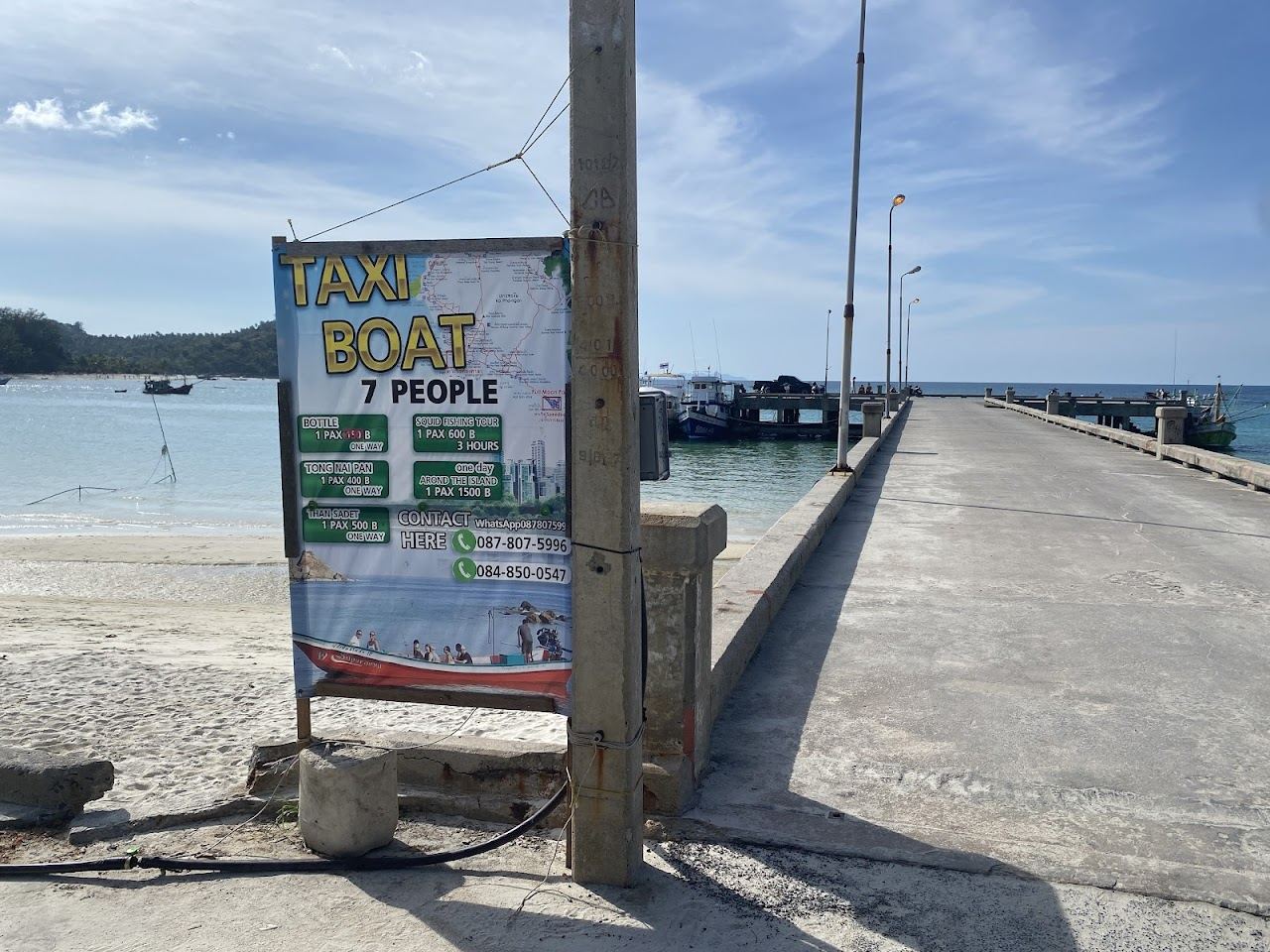 The fishing pier and longtail boats facing the seafood restaurants of Chaloklum village on Koh Phangan