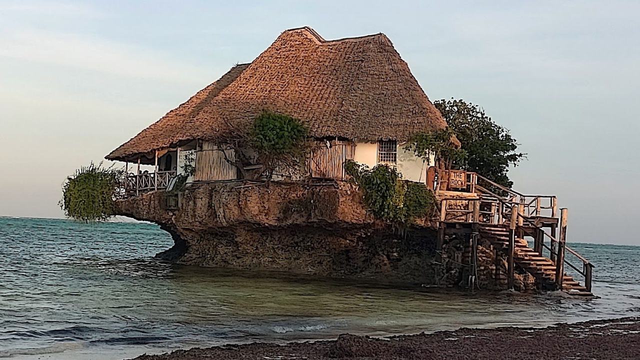 Wide calm water and a working fishing shore at Chwaka Bay on the east coast of Zanzibar