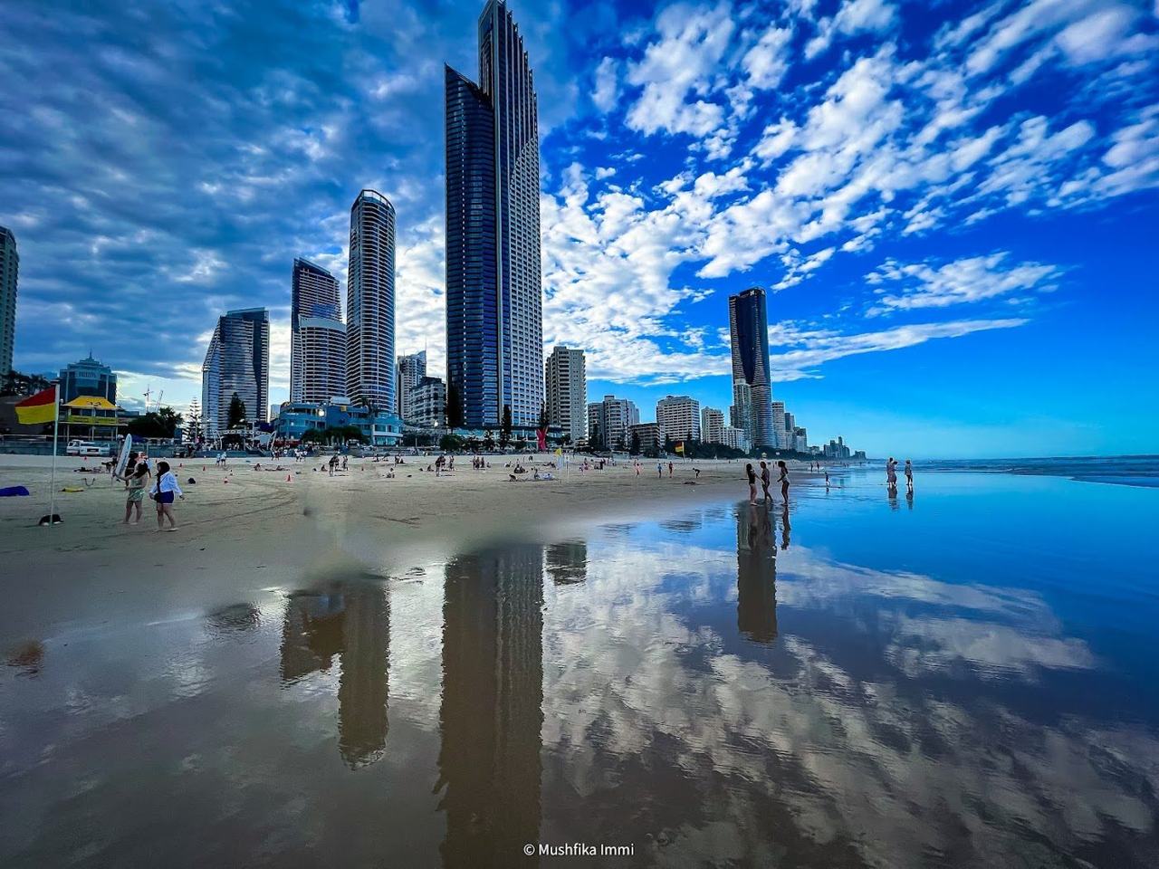 The long straight beach of Surfers Paradise on the Gold Coast backed by a wall of high rises