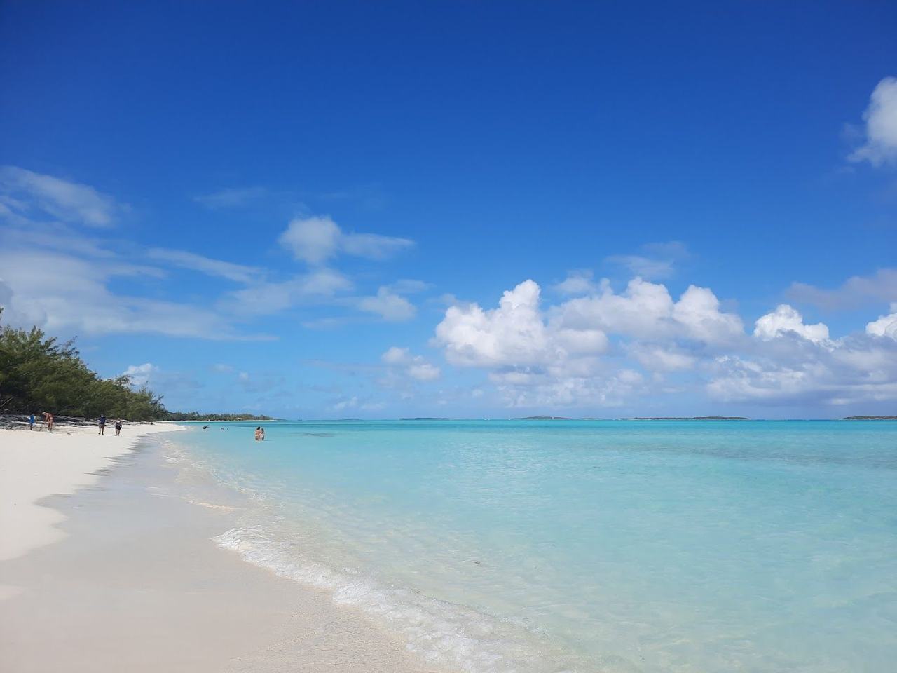 Coco Plum Beach sandbar rising through clear shallow turquoise water on Great Exuma