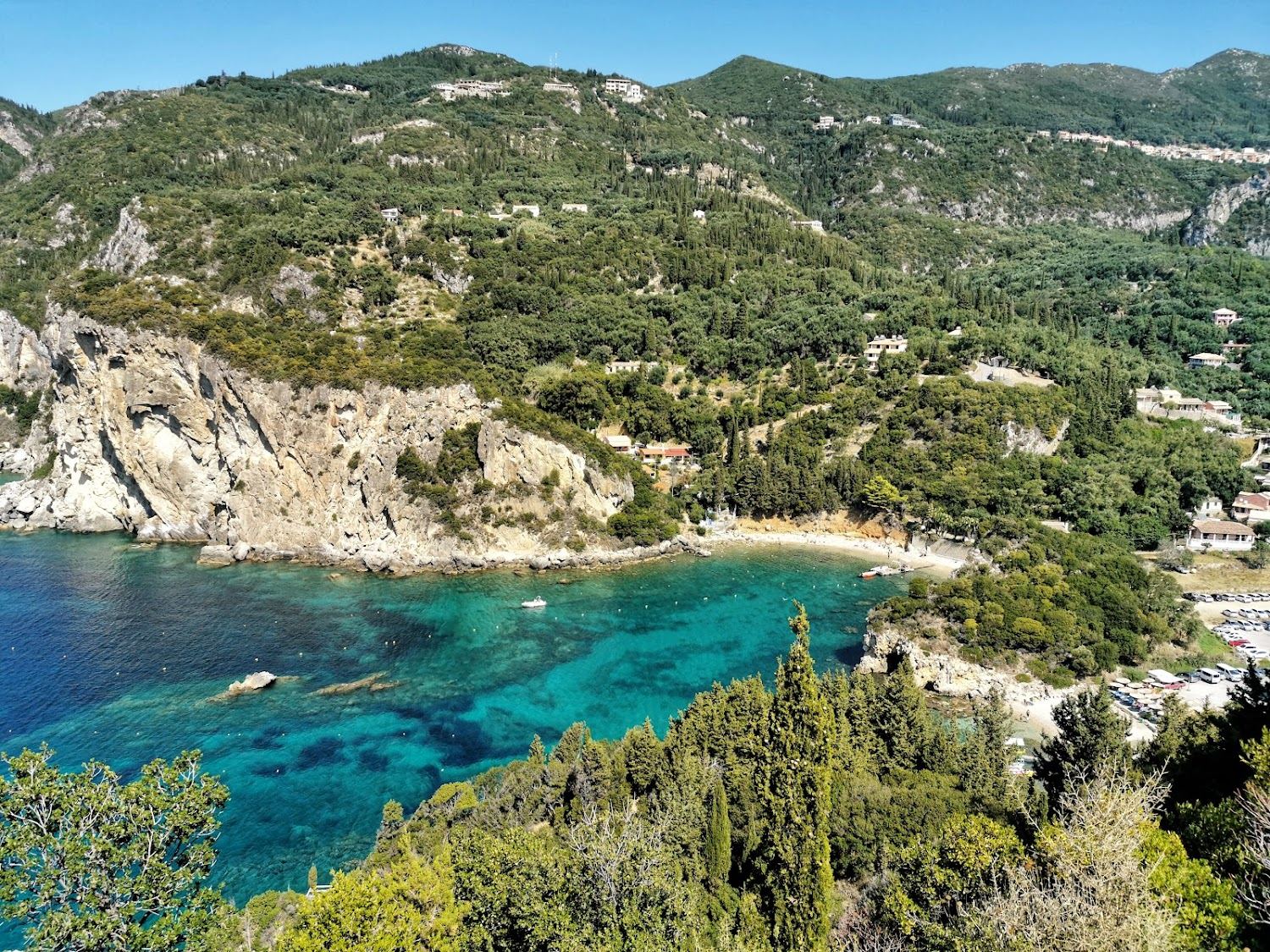 The green cliffed coves and clear water of Paleokastritsa on the northwest coast of Corfu