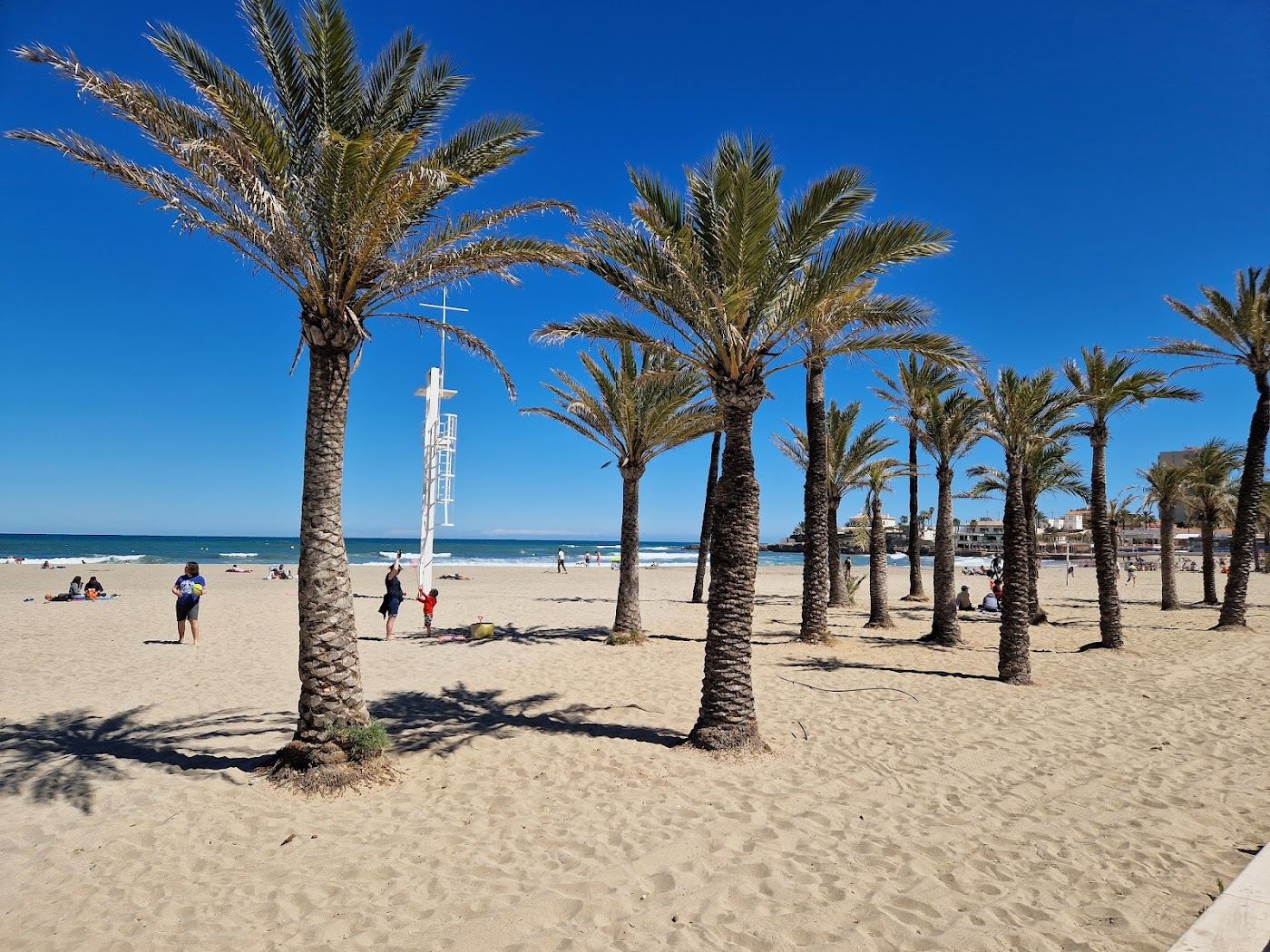 Soft golden sand and calm shallow water at a family beach on the Costa Blanca
