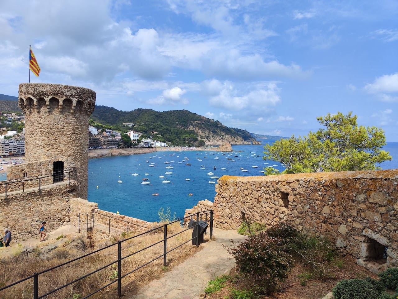 The floodlit medieval Vila Vella headland glowing above the town beach at Tossa de Mar on the Costa Brava