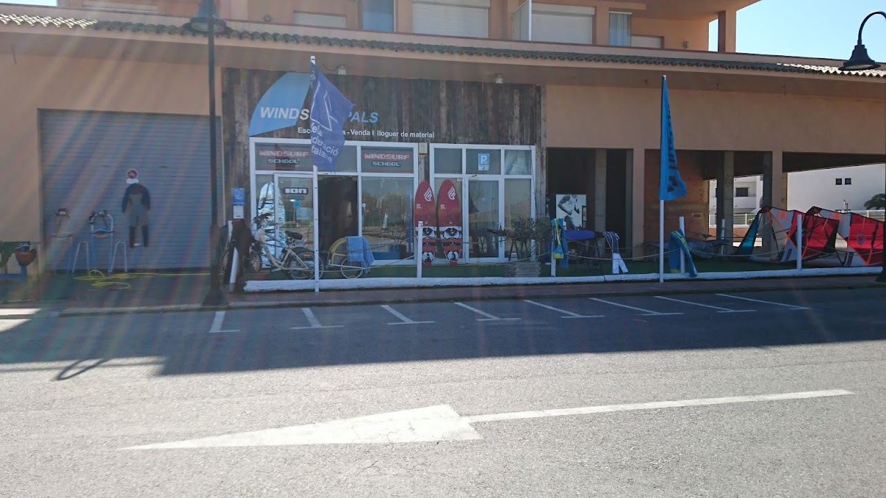 Windsurfers on the wide open sand of Platja de Pals on the Costa Brava