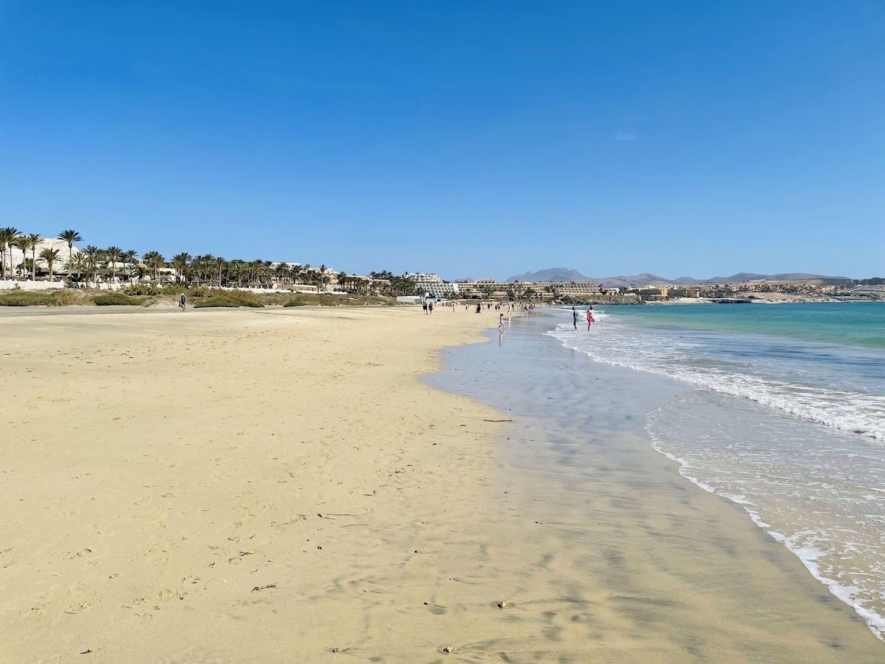 Calm golden resort beach and shallow water at Costa Calma in southern Fuerteventura