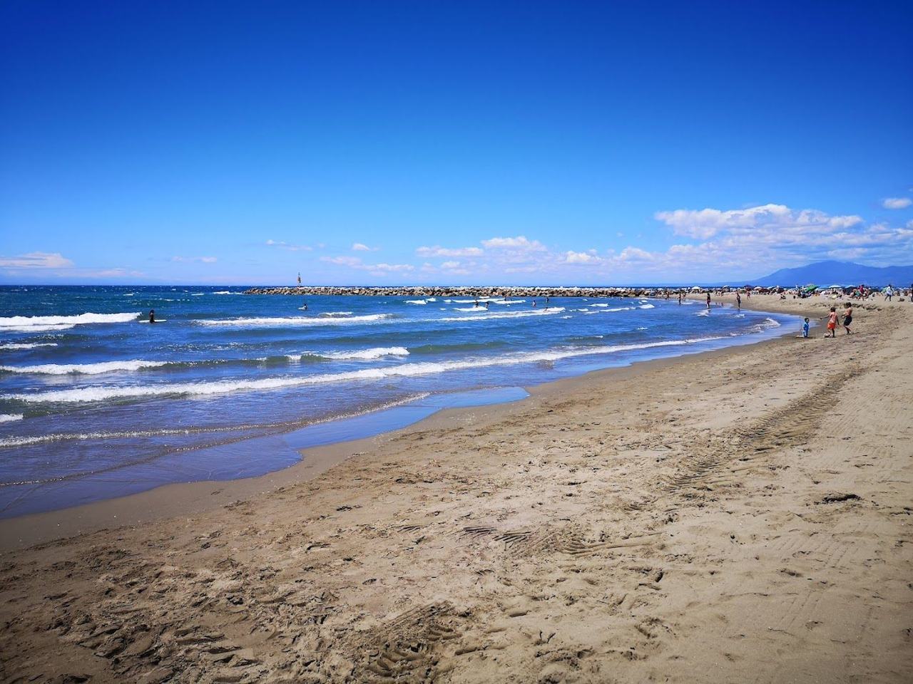 Calm clear shallows over sand at Cabopino beach near Marbella on the Costa del Sol