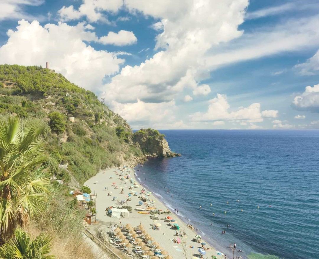 Rocky cove and clear water at Maro beach near Nerja on the Costa del Sol