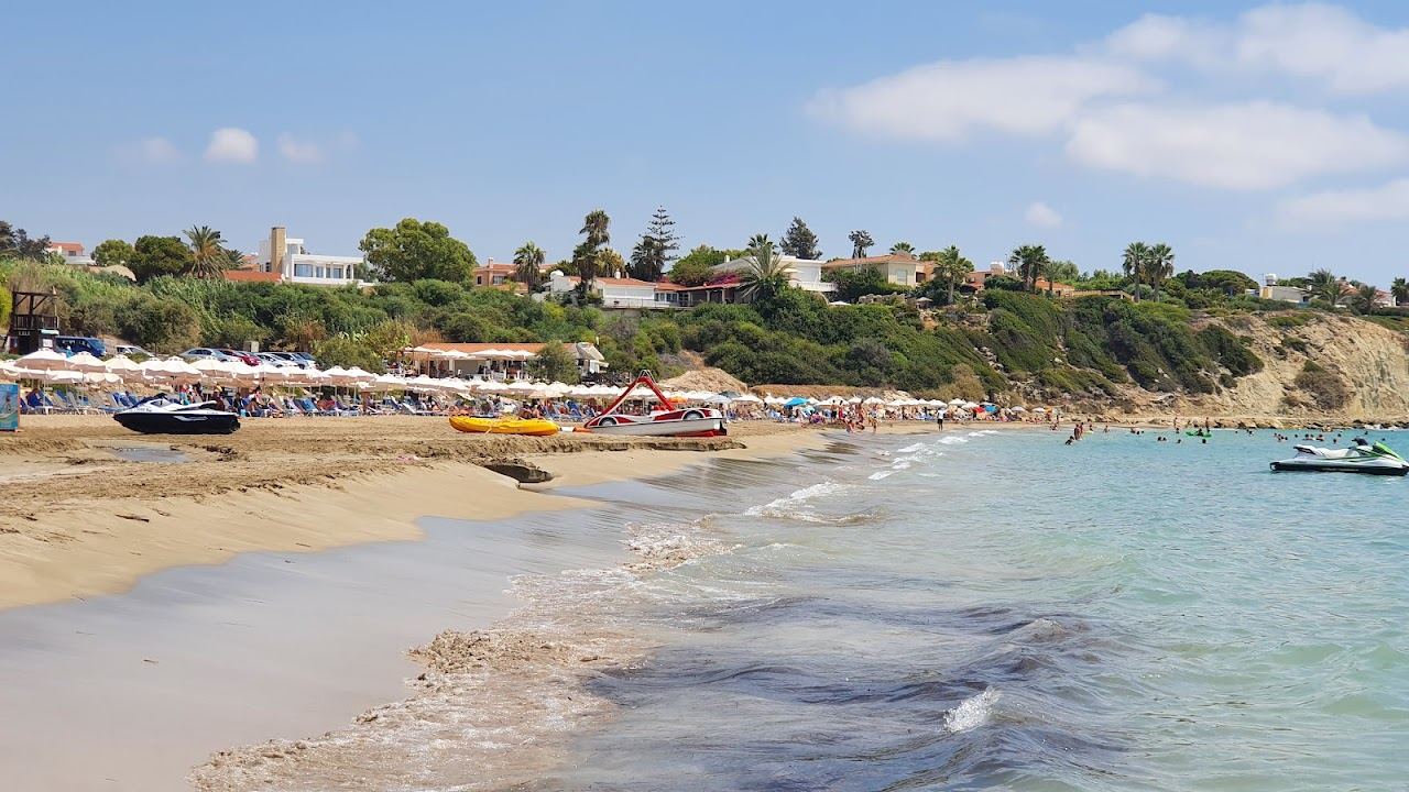 Evening light over the sheltered west facing crescent at Coral Bay near Paphos in western Cyprus