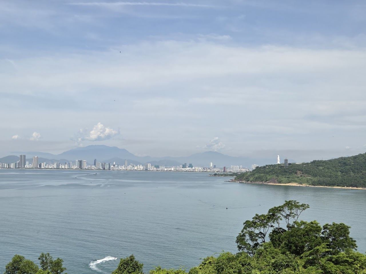 Evening light over Da Nang Bay from the Son Tra peninsula with the city and mountains beyond