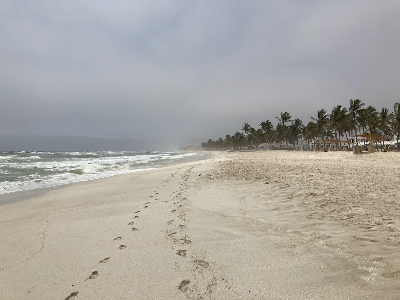 The cafe strip and open sand behind Dahariz Beach in Salalah