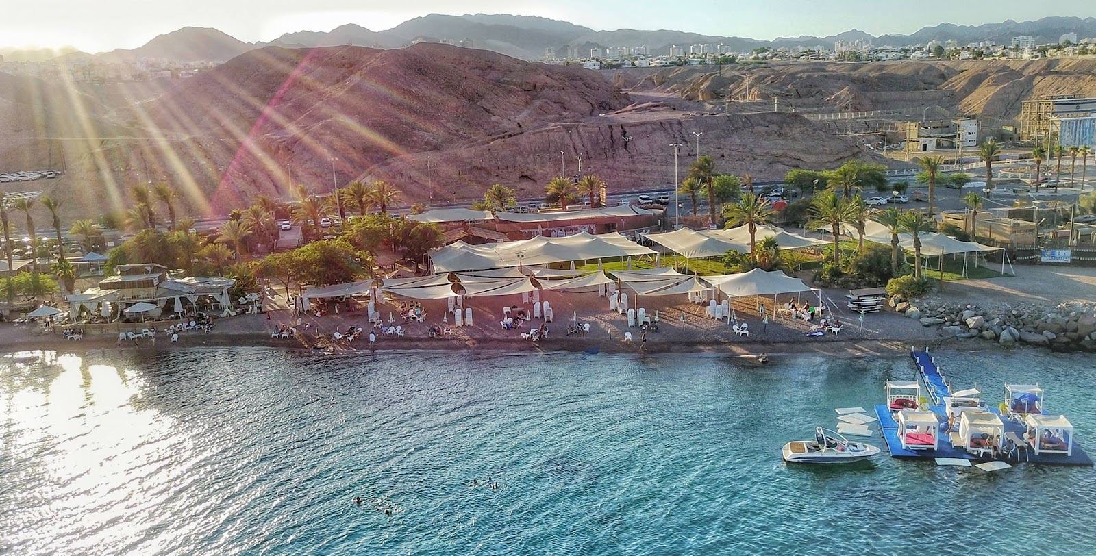 Sun loungers and the calm central bay at Dekel Beach in Eilat
