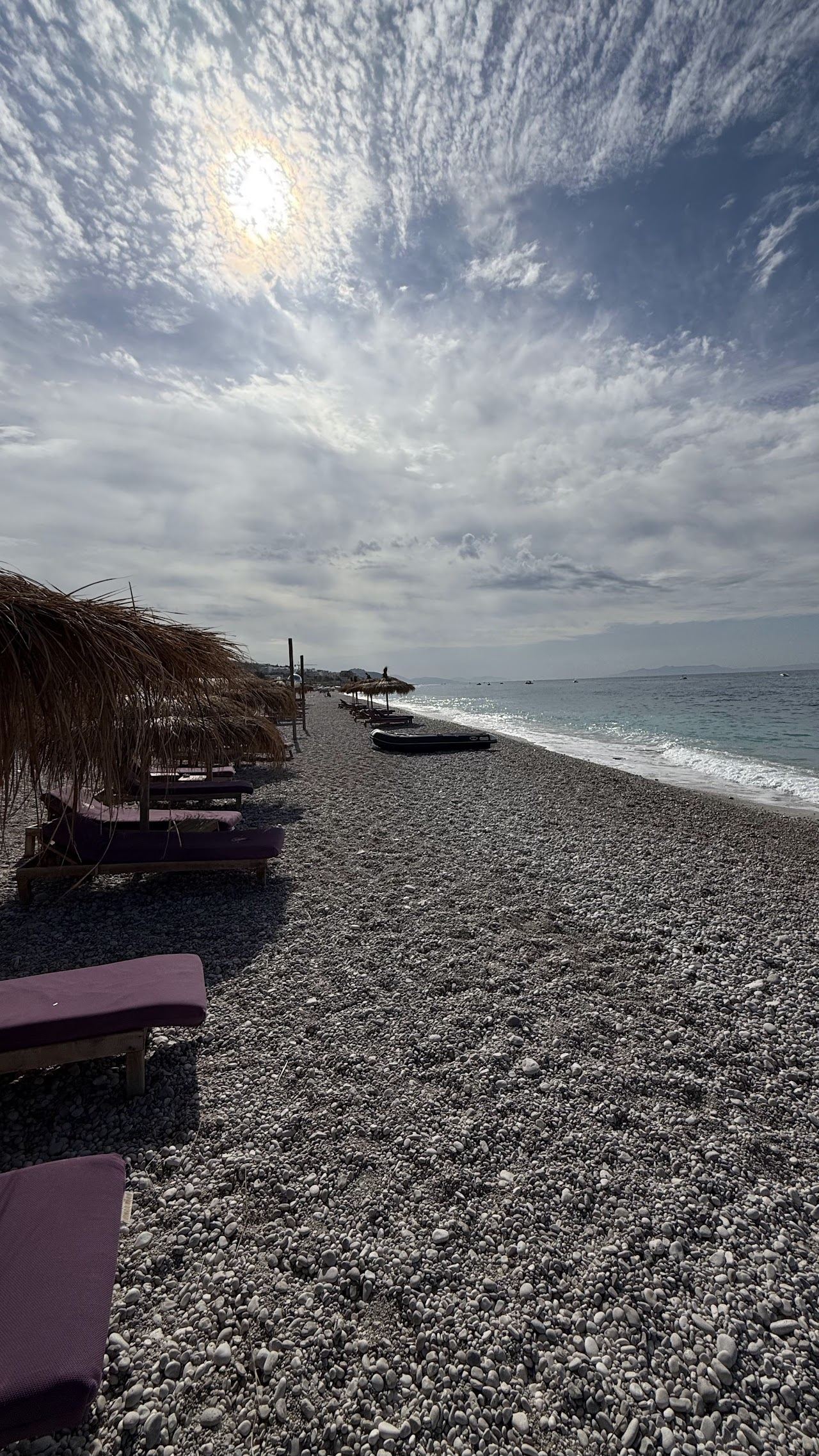 The pebble shore and mountain backdrop at Dhermi on the Albanian Riviera