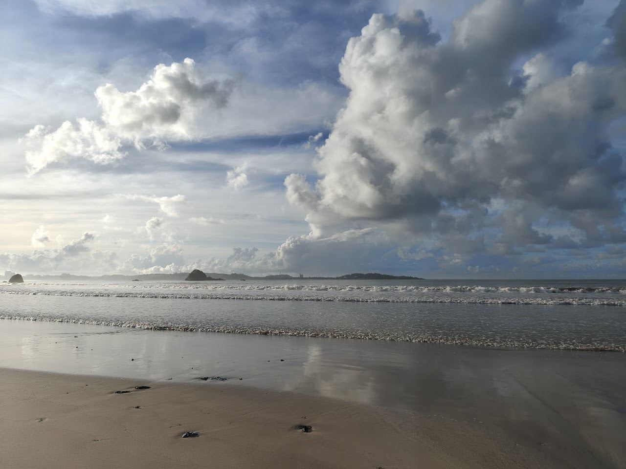 A wide beginner surf bay lined with cafes at Weligama on the south coast of Sri Lanka