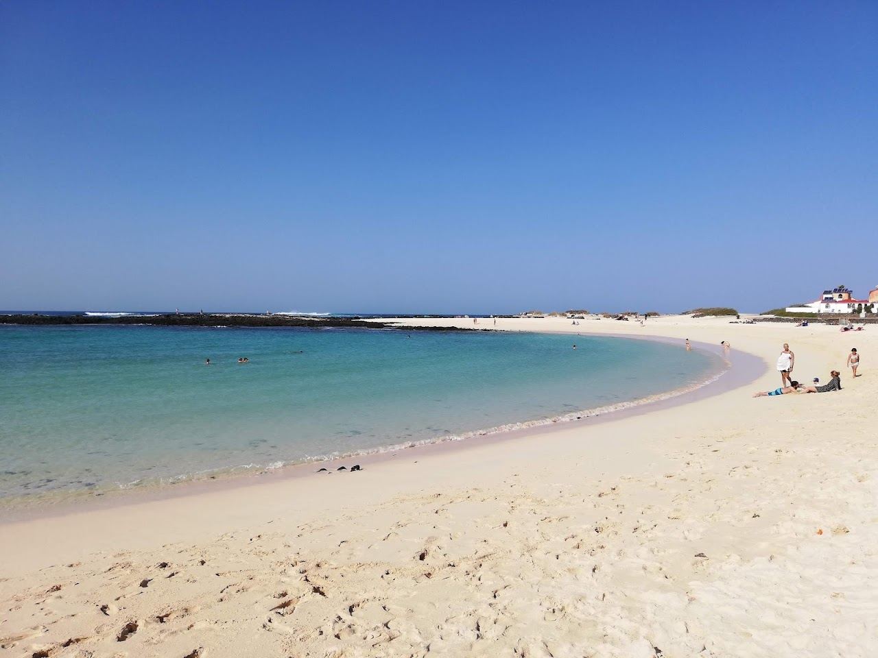 Clear turquoise reef sheltered lagoon and pale sand at the northern beaches of El Cotillo in Fuerteventura