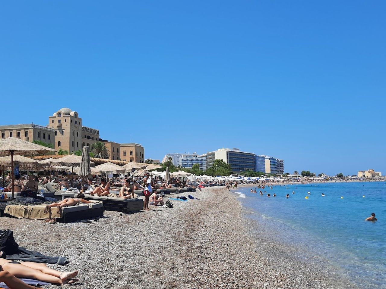 The diving platform and deep clear water off Elli beach on the northern tip of Rhodes town with the promenade behind
