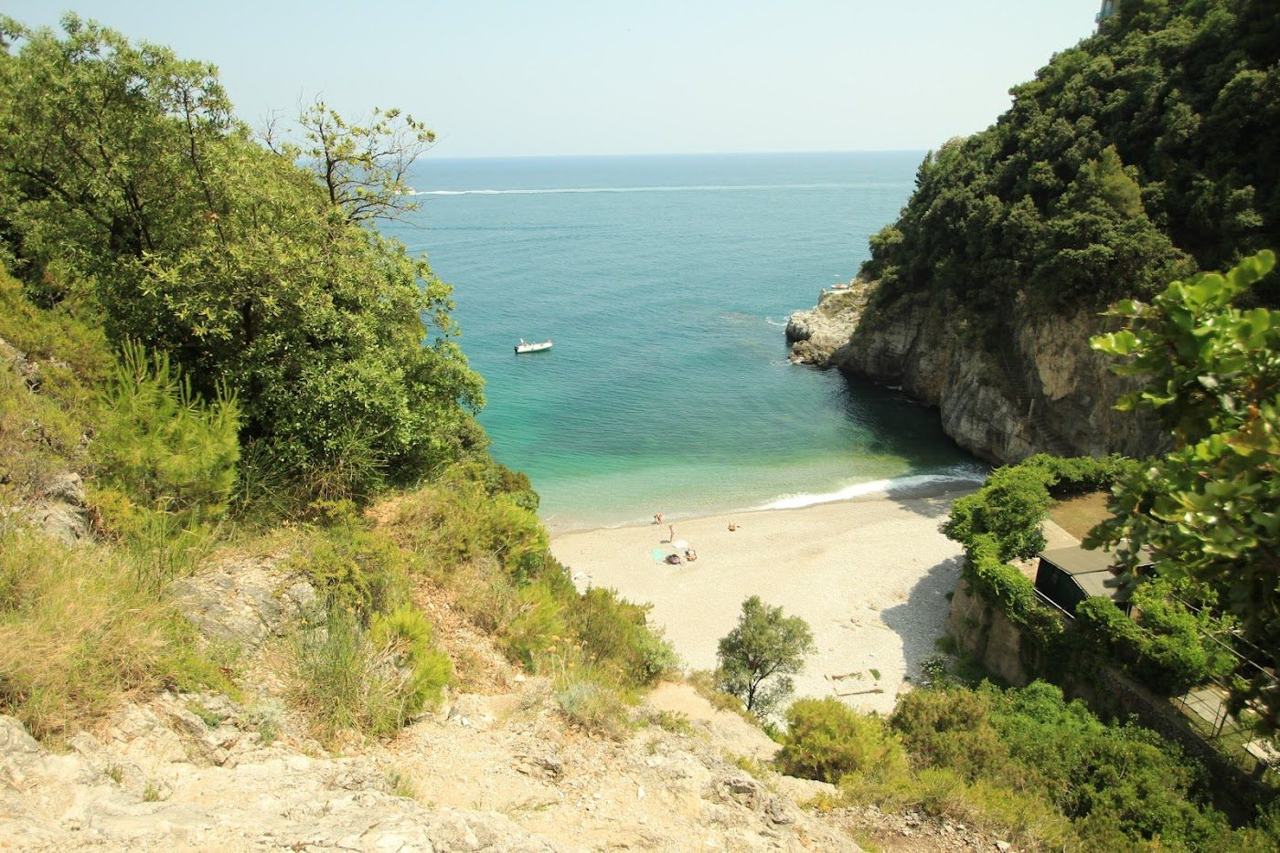 The small cove of Erchie below its watchtower between Maiori and Cetara