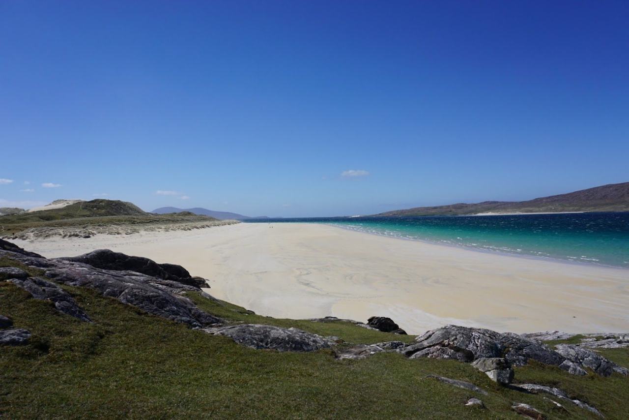 Vast pale sand and turquoise shallows backed by dunes at Luskentyre on Harris