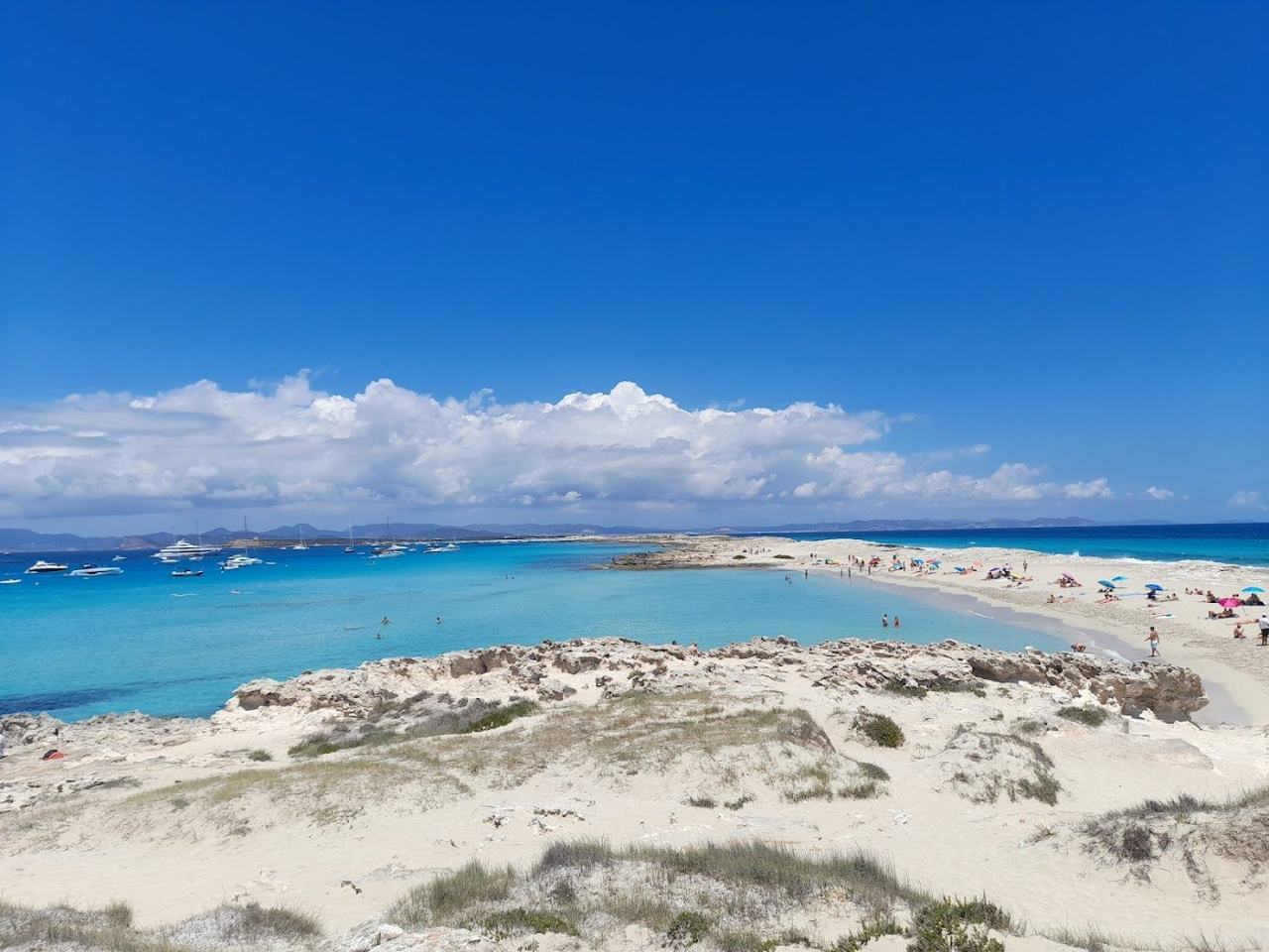 White sand and pale blue shallows on the spit at Ses Illetes, Formentera