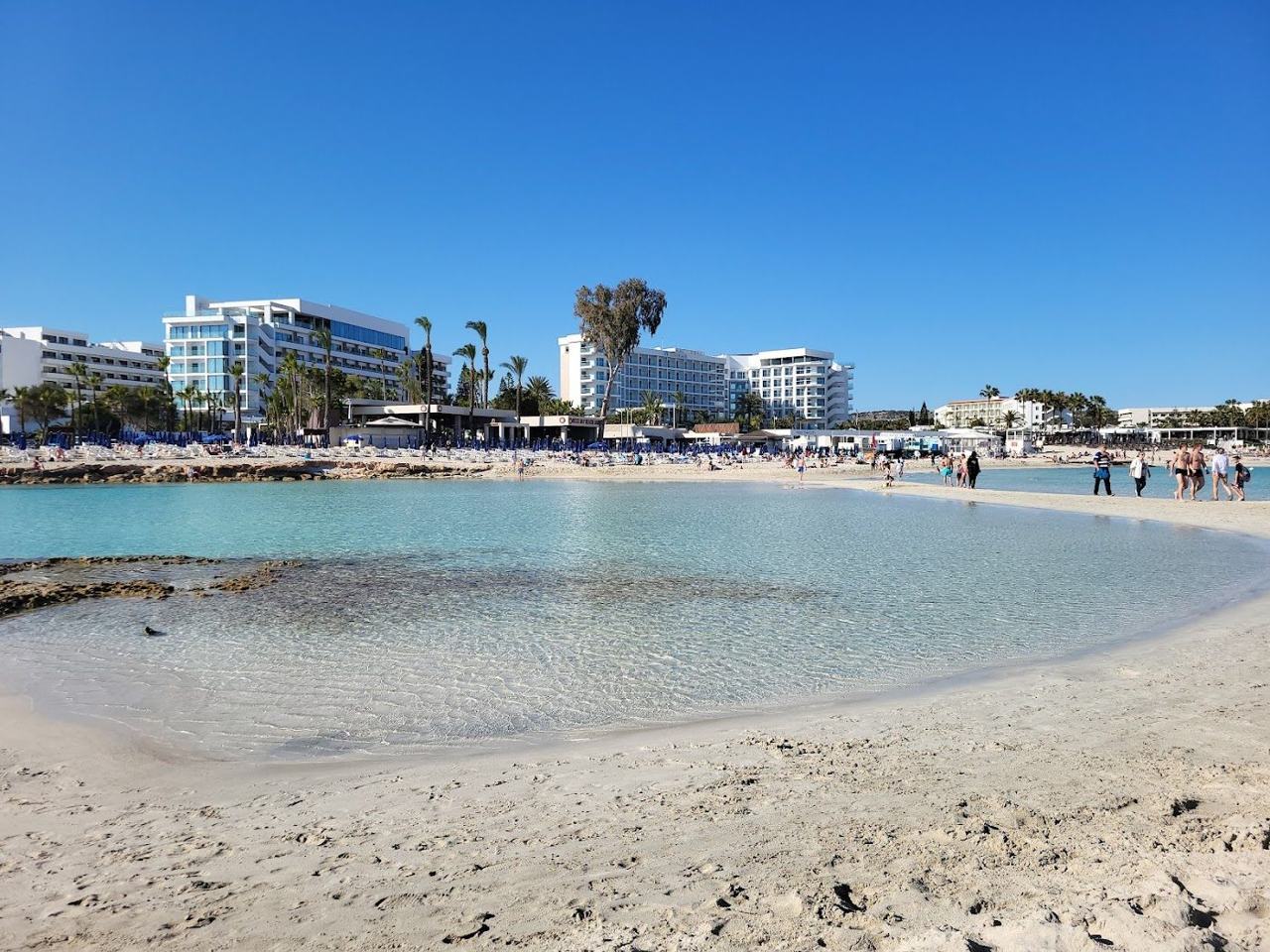 Shallow warm bays, blue flag sand and a long, dependable season on a relaxed eastern Mediterranean island.