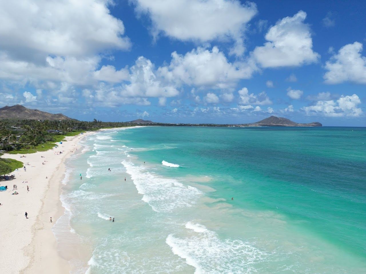 The wide soft sand and usually gentle water of Kailua beach on Oahu