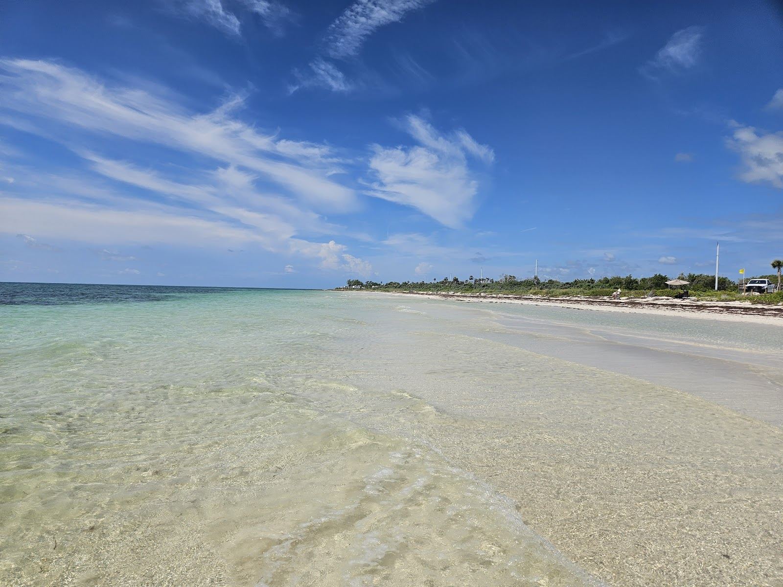 The long wild sand and clear shallow water of Sandspur Beach at Bahia Honda State Park in the Florida Keys
