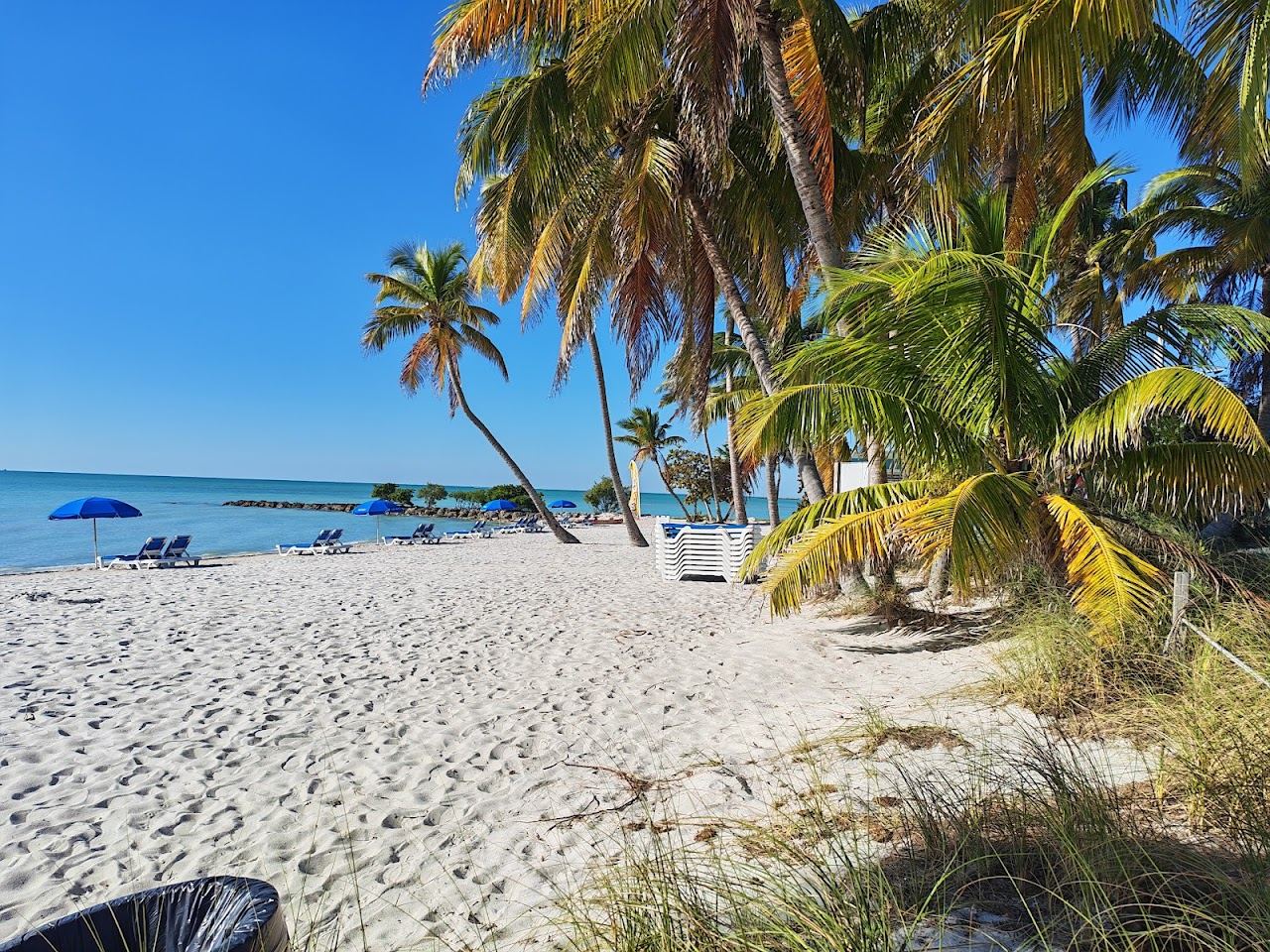 The long man made sand strip of Smathers Beach along the water in Key West in the Florida Keys
