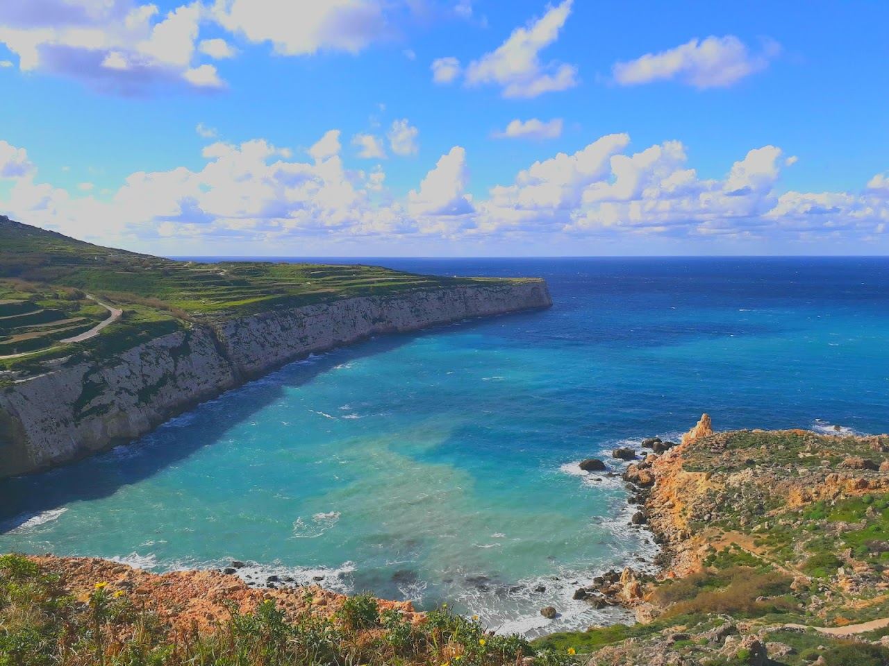 The wild cliff framed bay of Fomm ir Rih on the remote west coast of Malta
