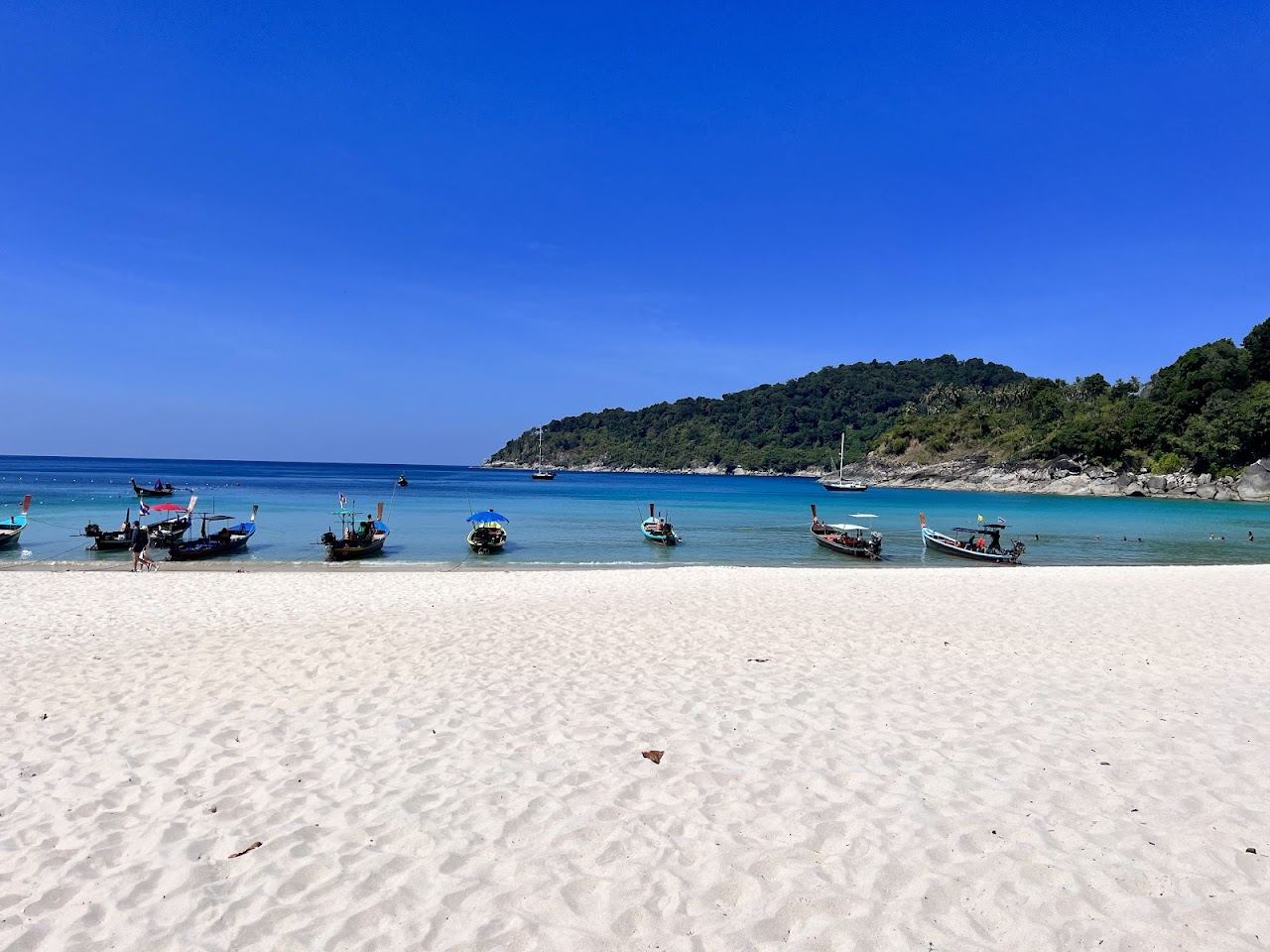 The white sand and clear water of Freedom Beach at the south end of Koh Tao