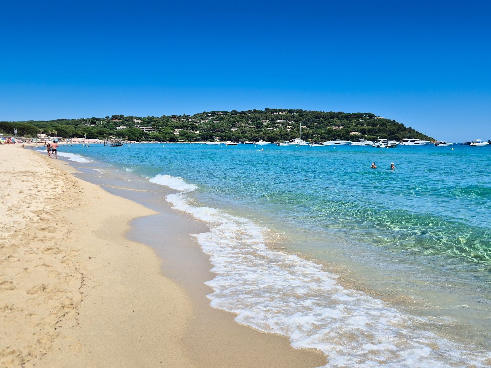 Pale golden sand and clear water along the long open shore of Pampelonne near Saint Tropez