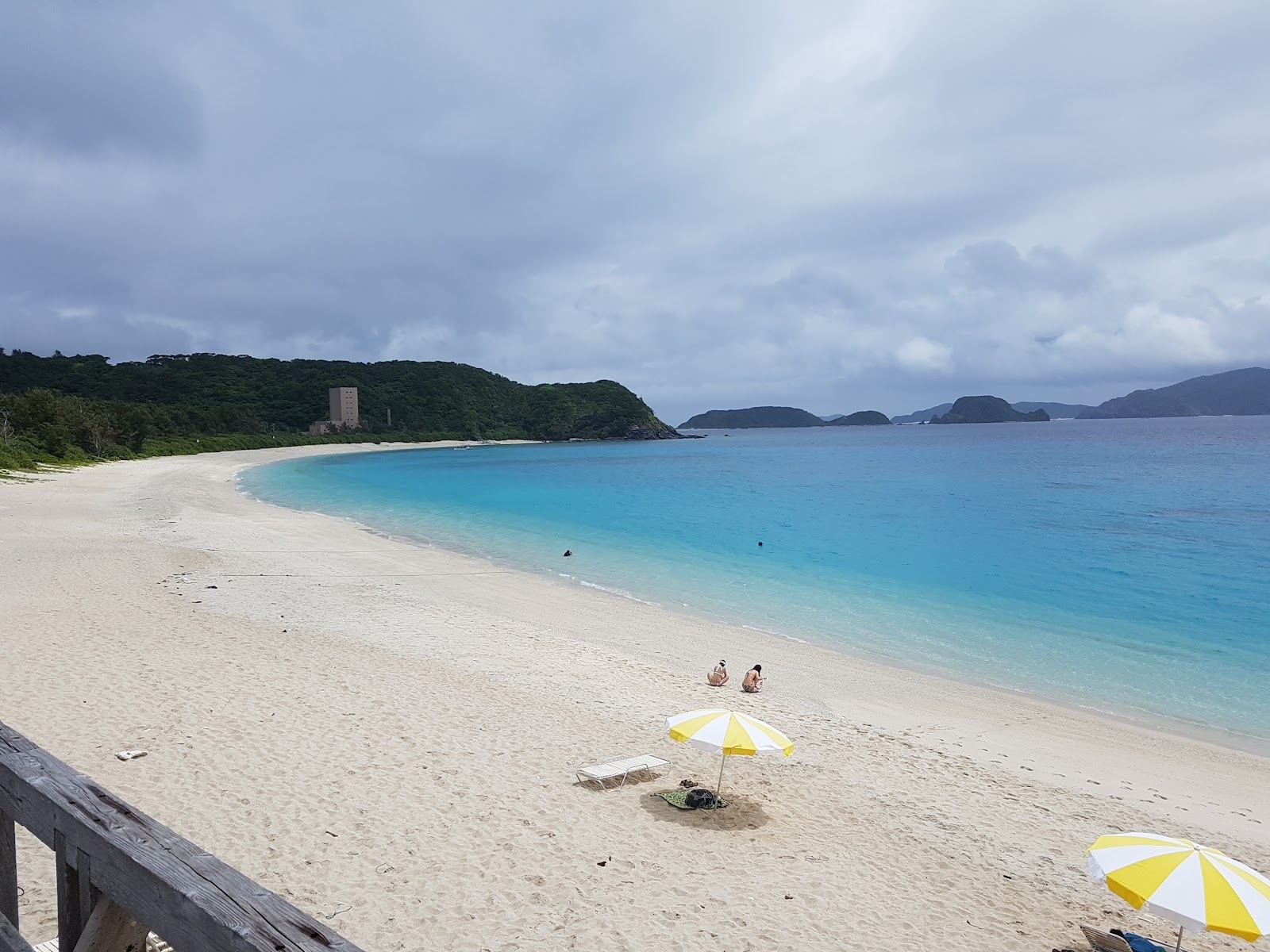 Snorkellers in the clear reef water off the white coral sand of Furuzamami Beach on Zamami, Okinawa
