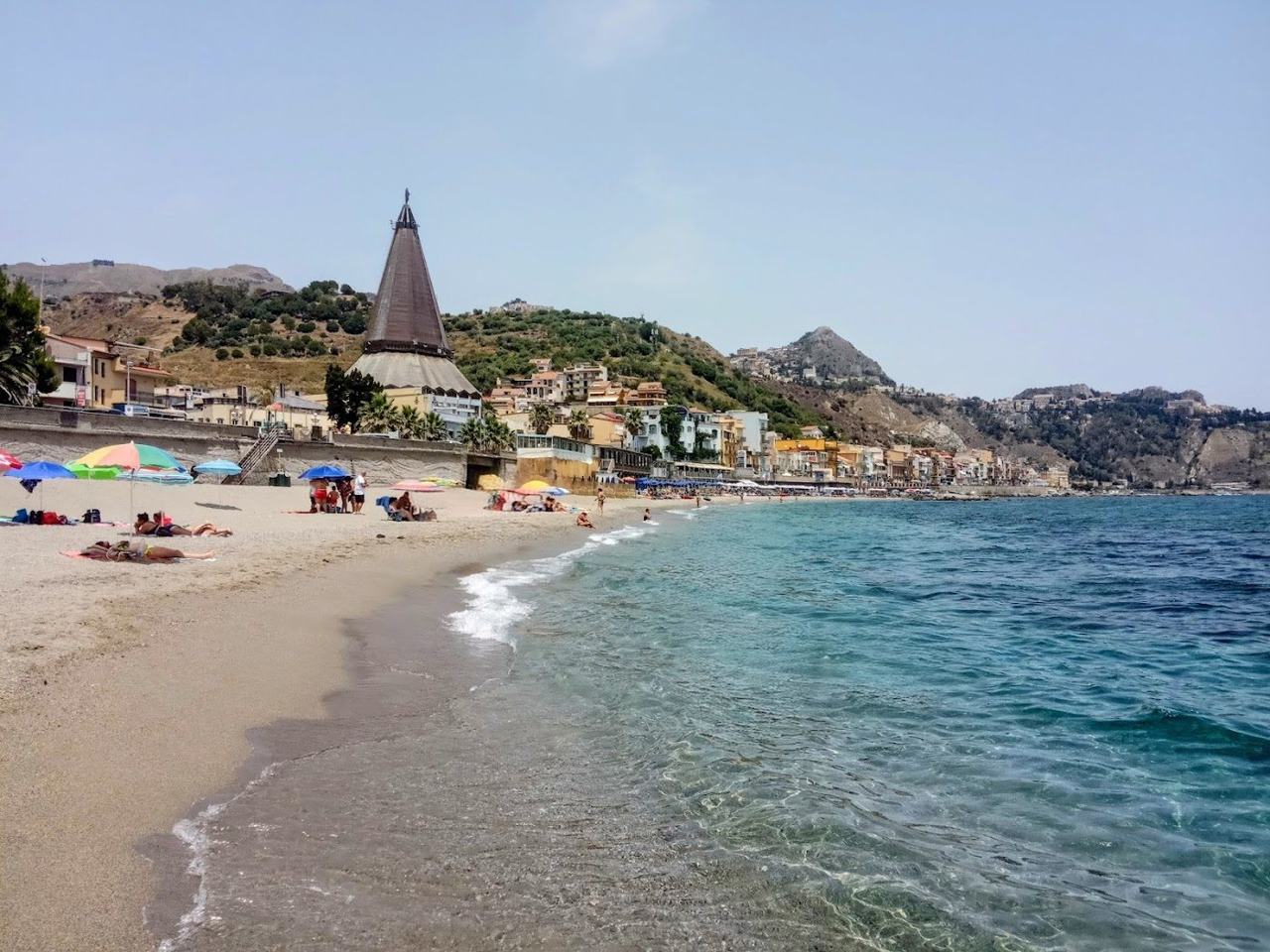 Giardini Naxos long resort bay and seafront below Taormina Sicily