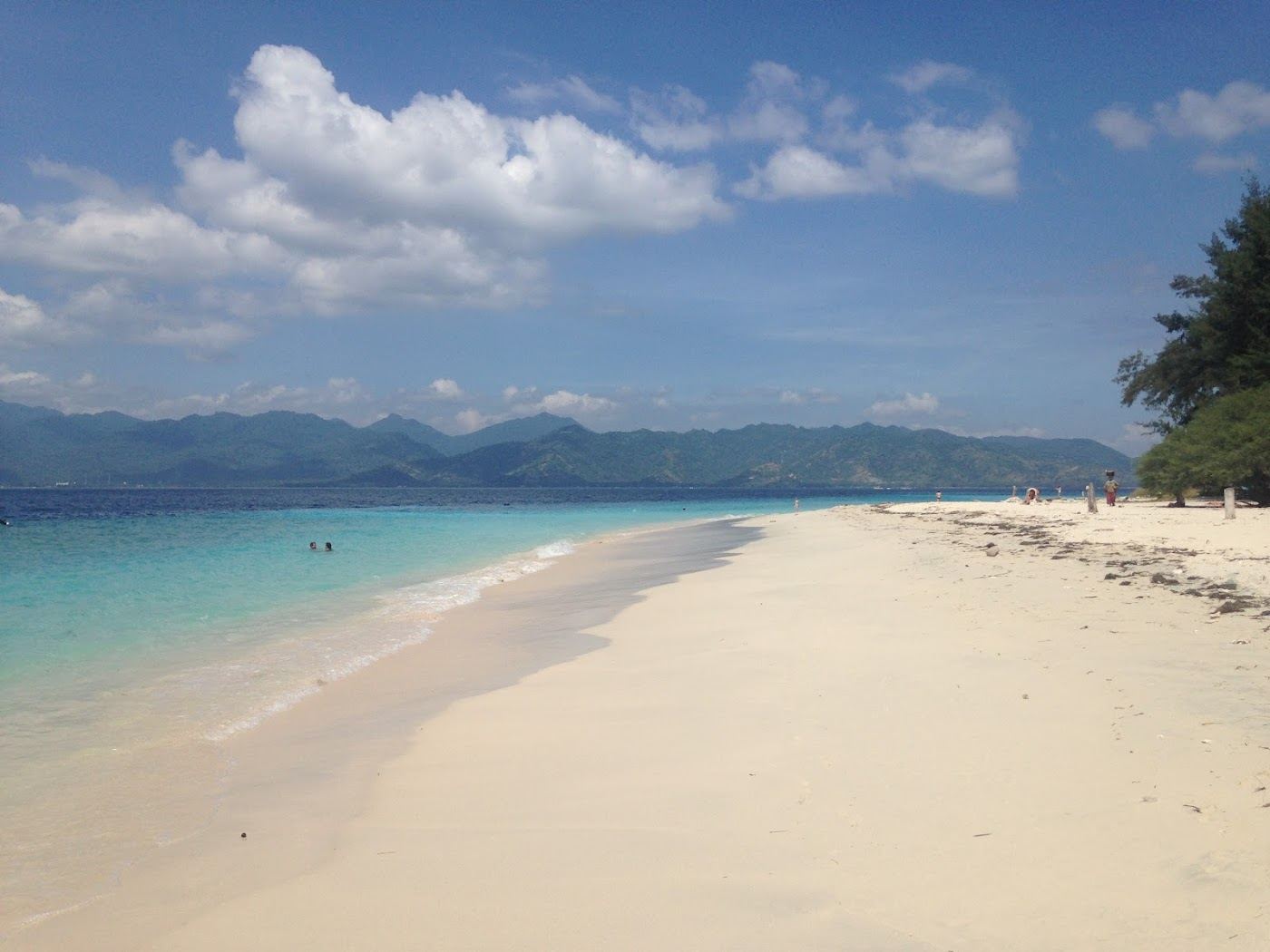 Empty white sand and clear water on a quiet thinly visited Gili Meno shore
