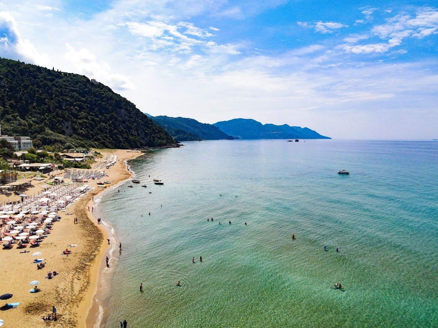 Golden sand and clear water at Glyfada beach on the west coast of Corfu