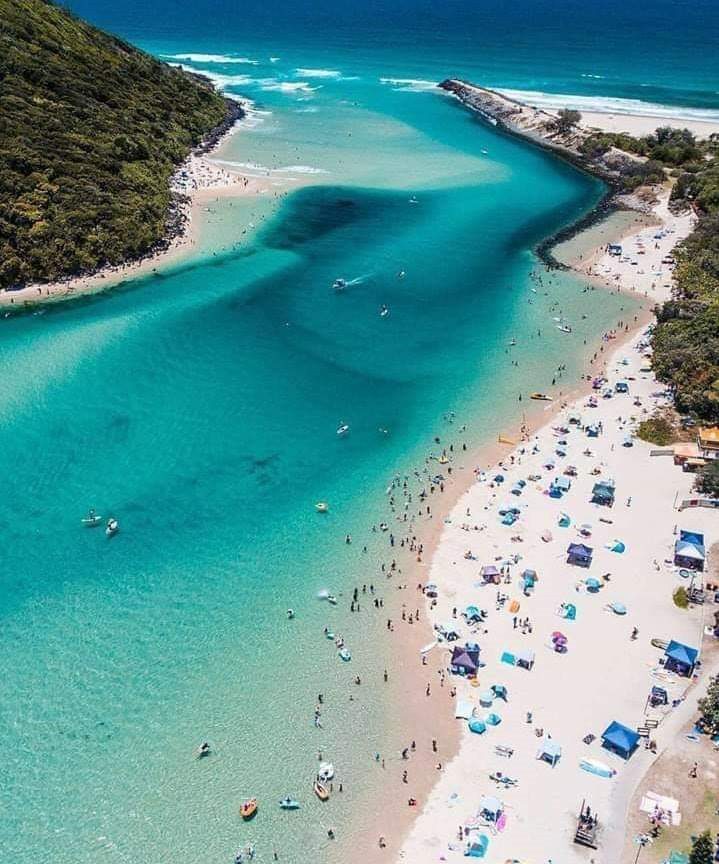 Calm clear tidal water and sandbars at Tallebudgera Creek on the southern Gold Coast in Queensland Australia