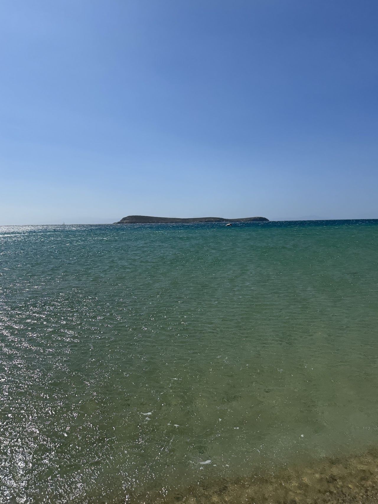The long golden sand and shallow clear water of Golden Beach on the southeast coast of Paros