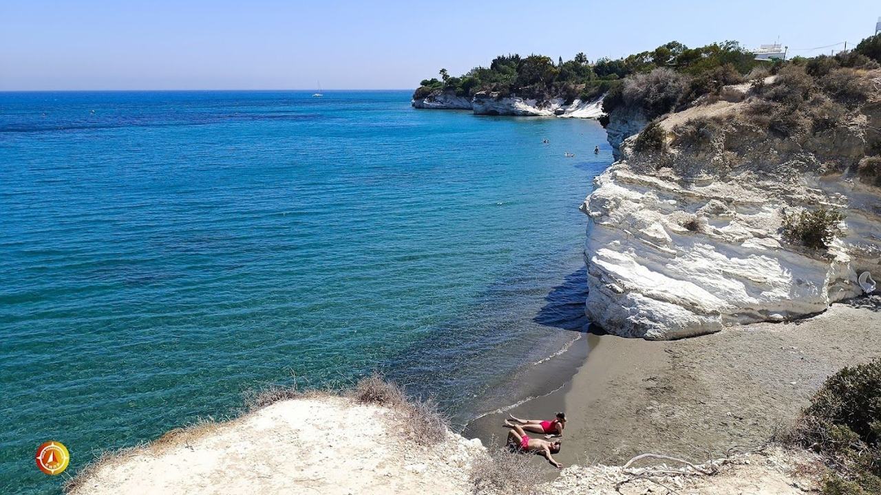 White chalk cliffs and a sheltered cove with sunbeds at Governor's Beach between Limassol and Larnaca in Cyprus