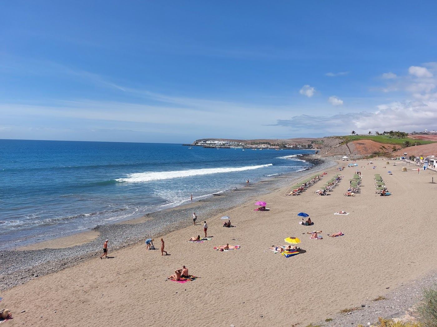 Palm lined promenade and golden beach in the Meloneras resort, southern Gran Canaria