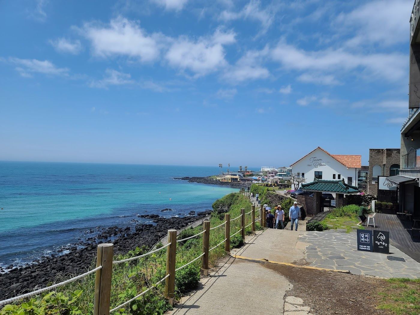 Black volcanic rock shore and ocean view of the Hagwi to Aewol coastal road on the northwest coast of Jeju