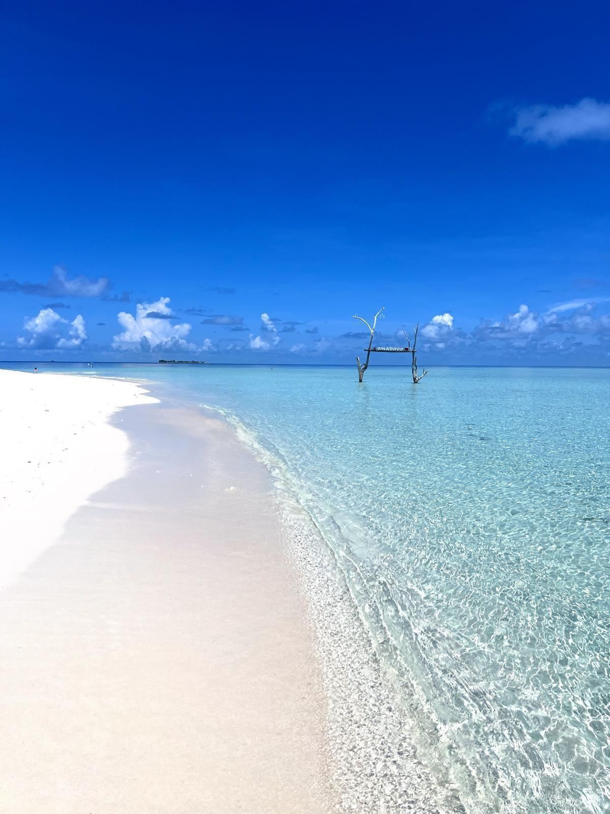 Calm clear water and white sand at the bikini beach on Hangnaameedhoo in the Maldives