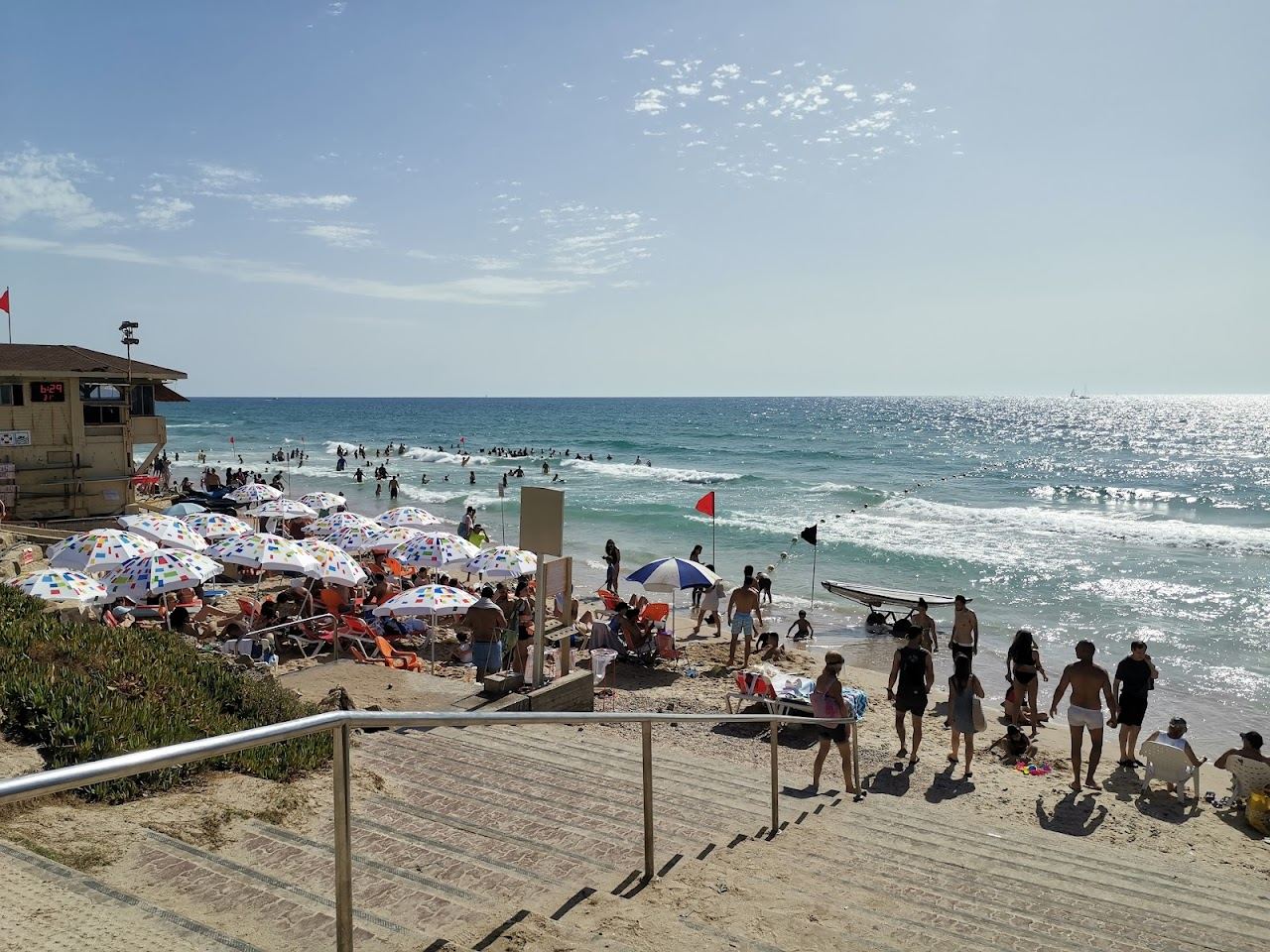 The sunbeds, soft sand and open sea of the managed section at Hatzuk beach in northern Tel Aviv