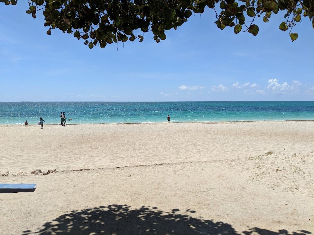 Hellshire Beach Portmore Jamaica fishing boats and a row of seafood shacks on golden sand