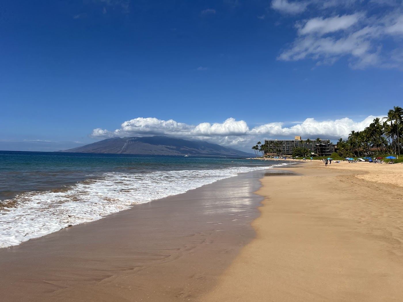 The long soft strand of Keawakapu Beach at sunset south of Wailea on Maui