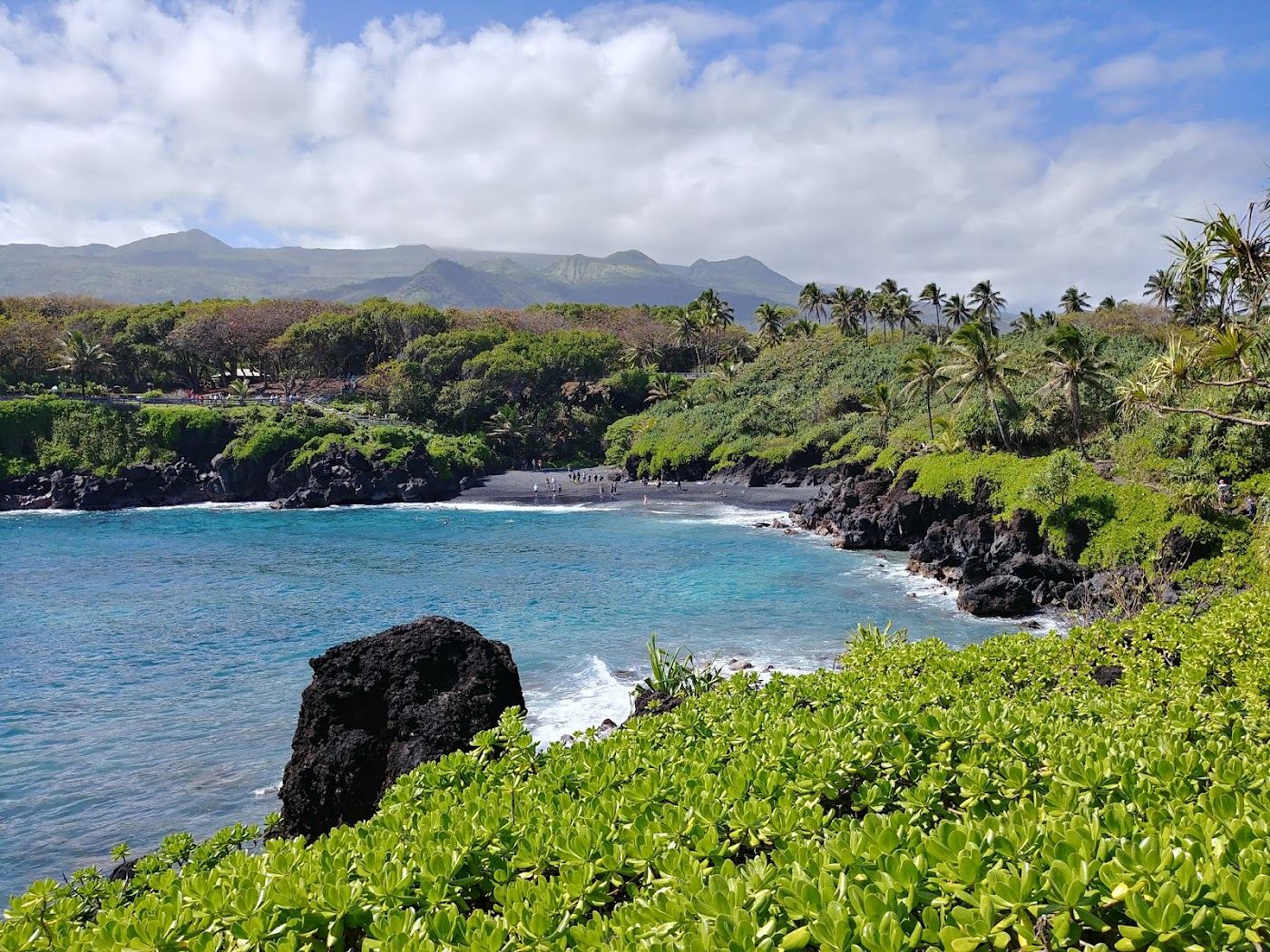 The jet black sand and lava caves of Waianapanapa State Park near Hana on Maui
