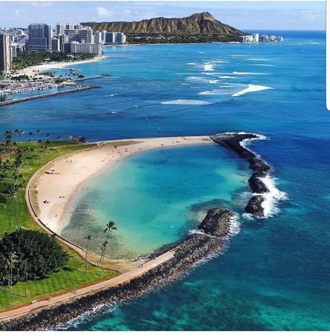 The calm reef flattened lagoon of Ala Moana Beach Park in Honolulu on Oahu