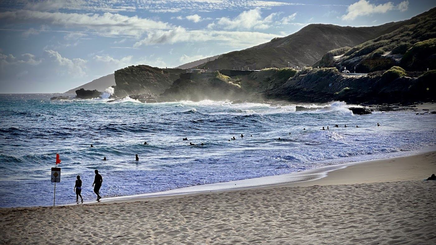The gold strand and heavy shorebreak of Sandy Beach on the southeast coast of Oahu