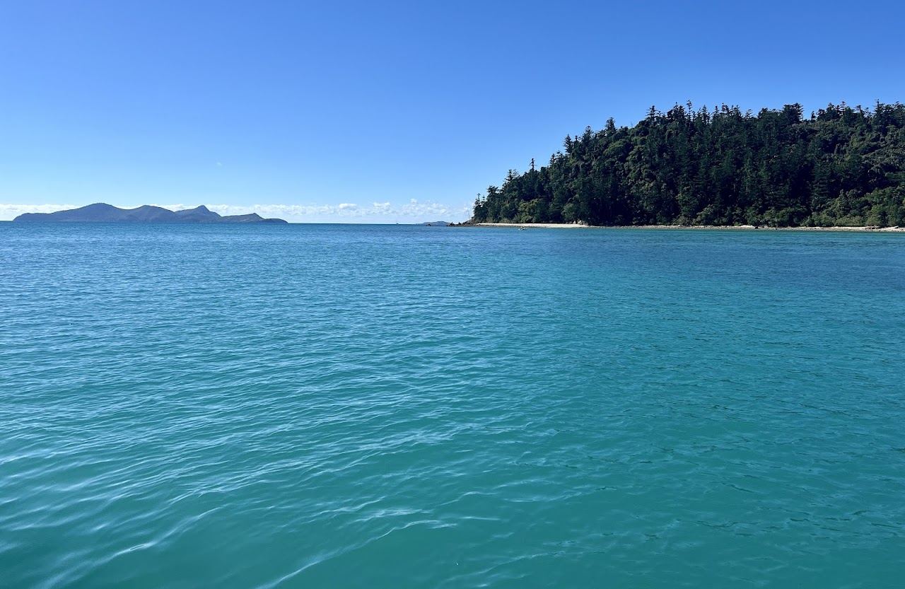 Boats anchored off the white sand at Tongue Bay below the Hill Inlet lookout on Whitsunday Island