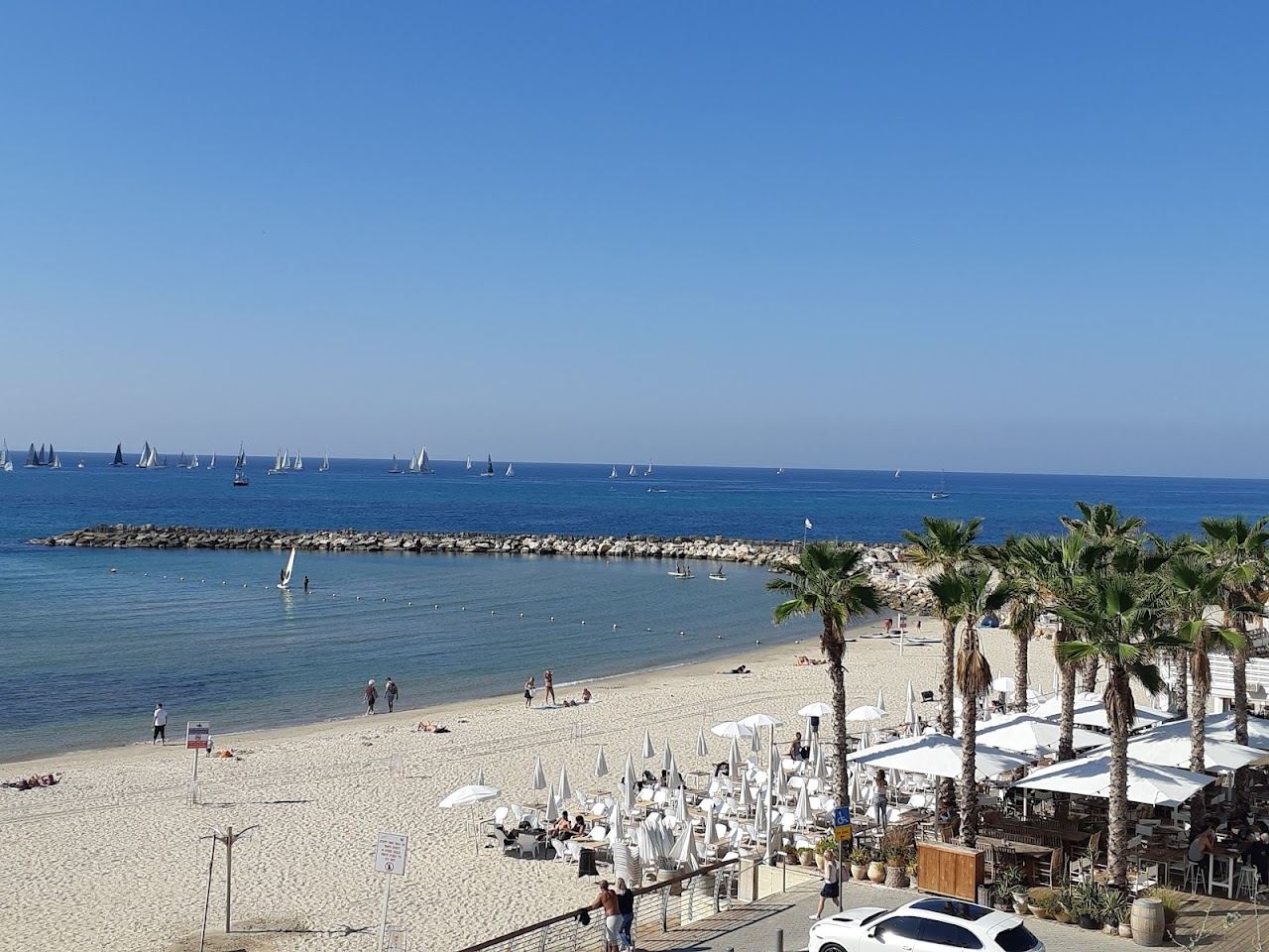 The roomy soft sand and clear sea of Hilton beach below Independence Park in north Tel Aviv