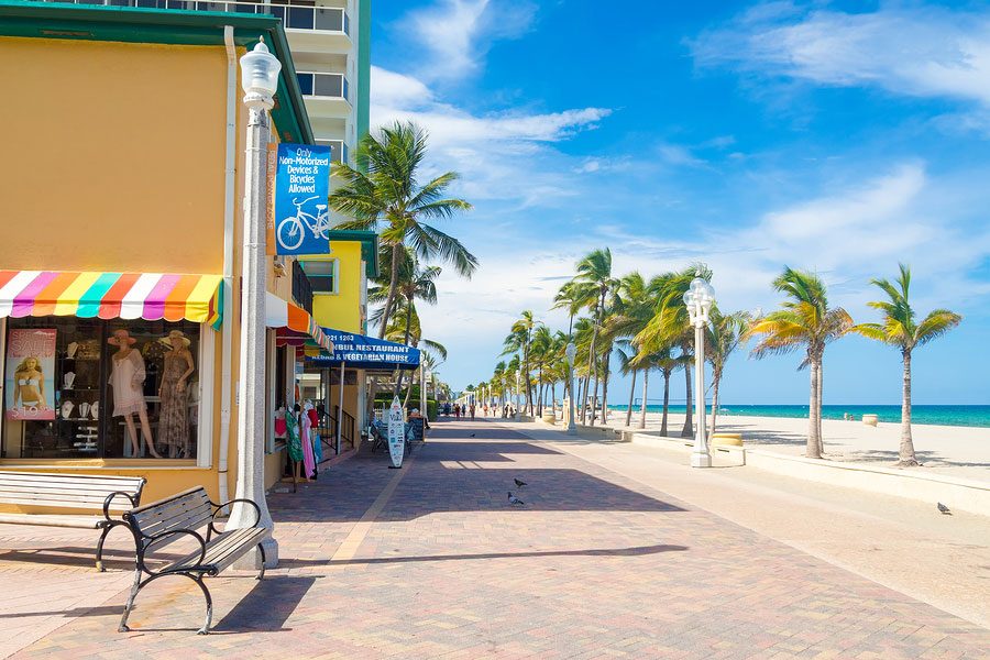 Hollywood Beach Florida wide pale sand beside the famous brick Broadwalk lined with cafes and palms