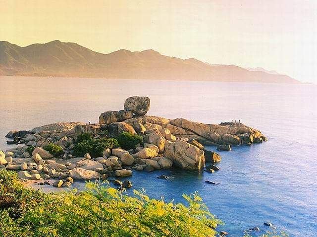 The stacked granite boulders of Hon Chong promontory above the bay at Nha Trang in Vietnam