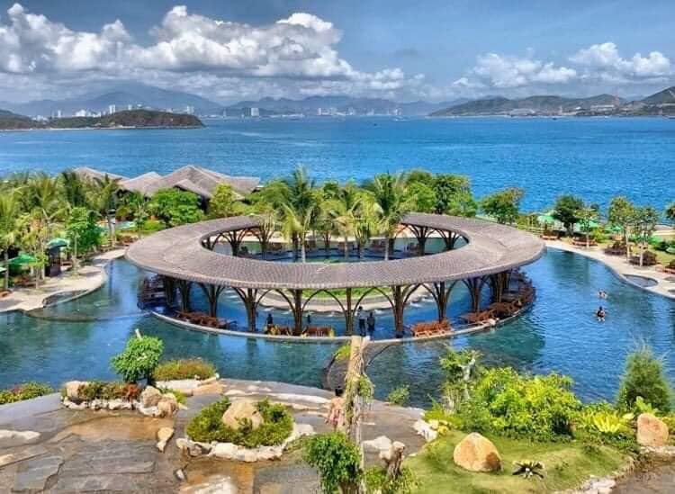 The calm crescent beach and clear water of Hon Tam island resort near Nha Trang in Vietnam